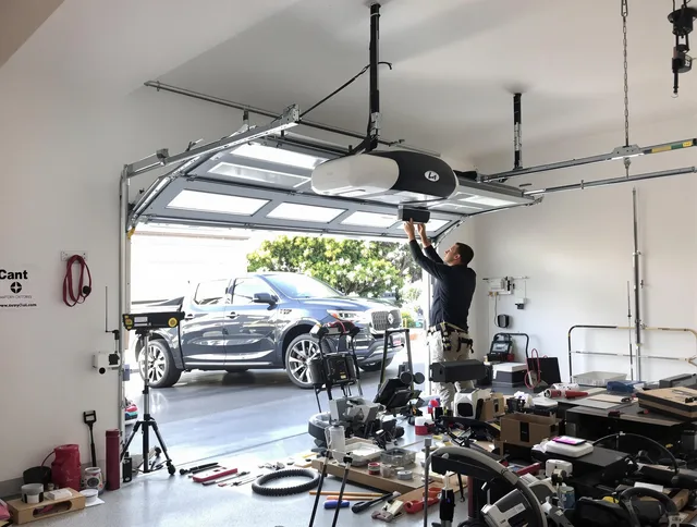 West Warwick Garage Door Repair specialist installing smart garage door opener system in West Warwick home