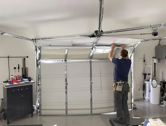 West Warwick Garage Door Repair specialist performing precise section replacement on West Warwick garage door