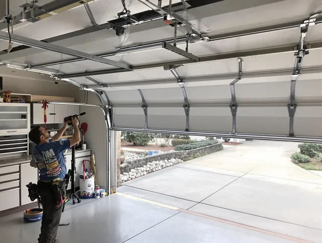 Garage door track repair service by West Warwick Garage Door Repair in West Warwick